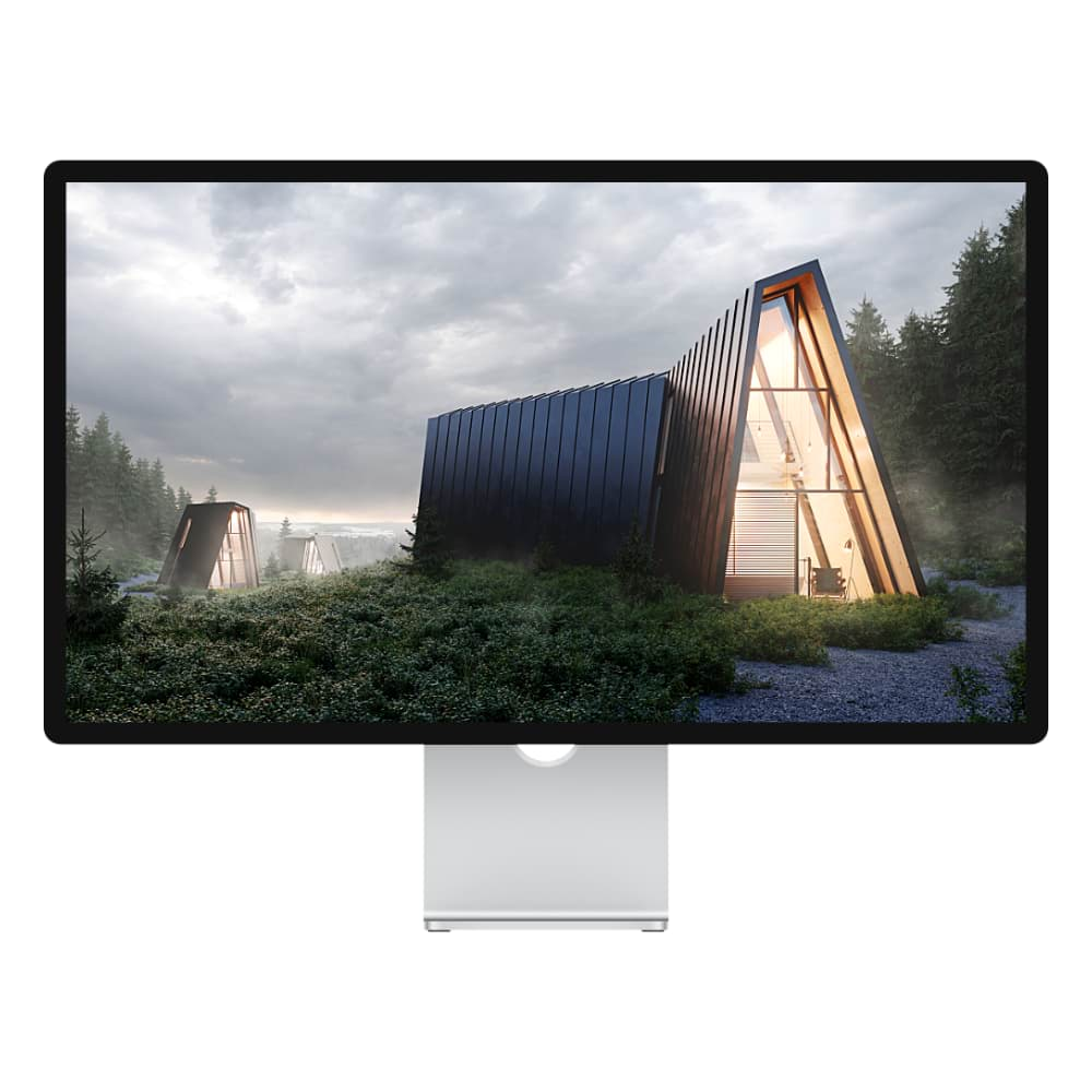 Mac display showing photo of ultra-modern, triangular cabins in a green forest with grey clouds overhead