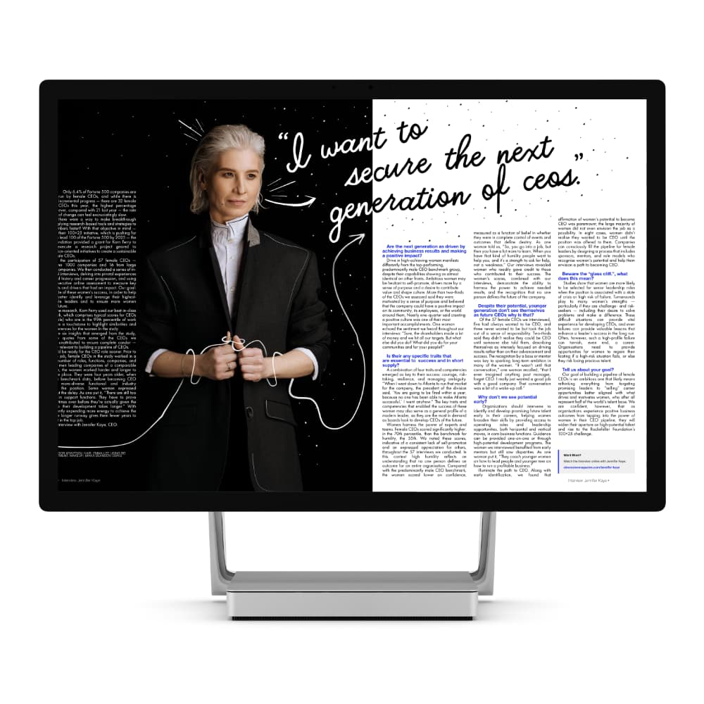 Windows display showing a magazine spread of a white-haired woman in black blazer, surrounded by black, white and blue text and designs